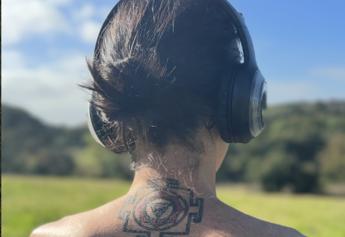 Breather in the landscape wearing headphones